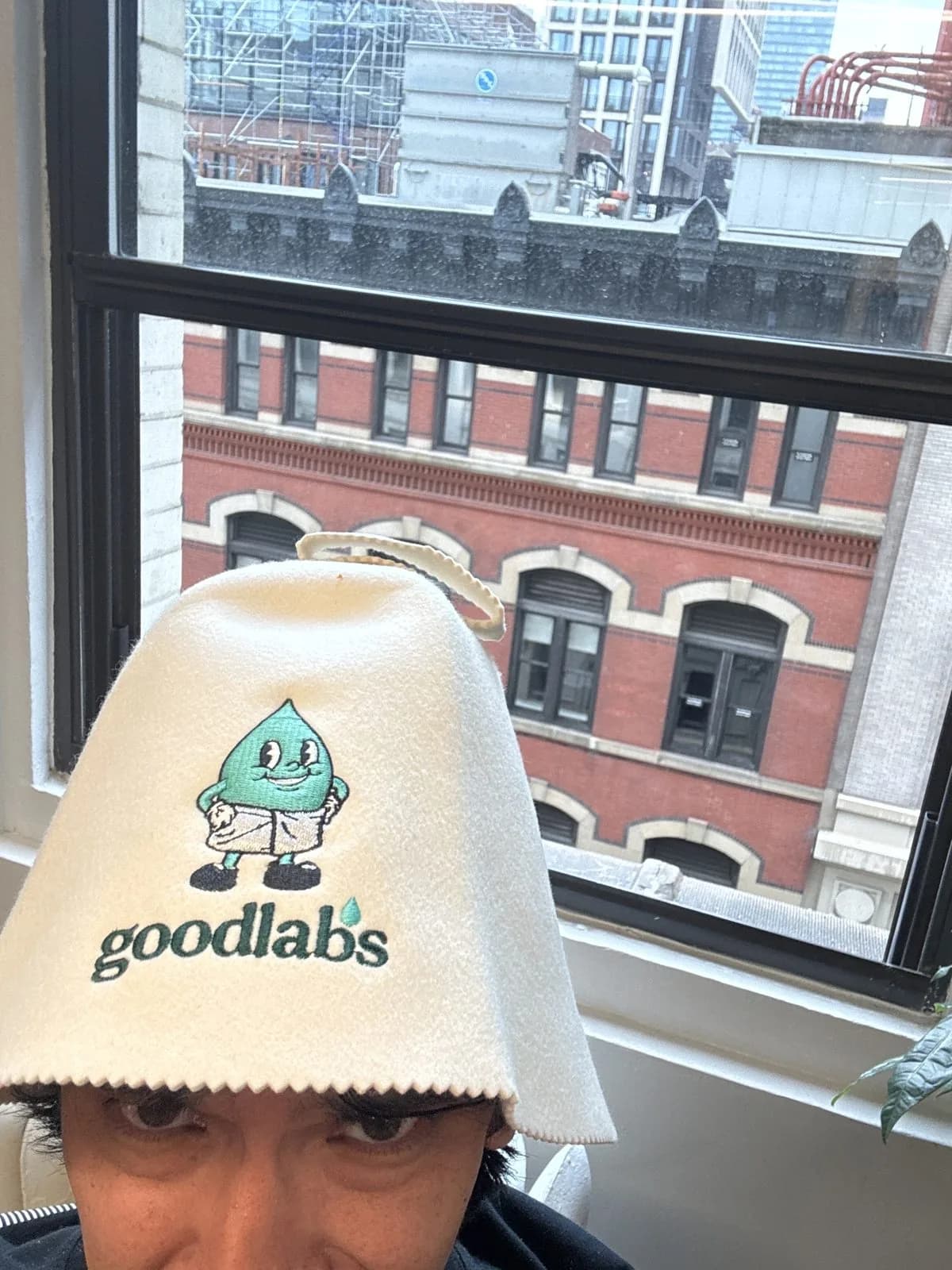 Goodlabs Feel Better Sauna Hat with Barry the blood drop, worn in the office